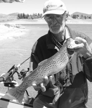Rick Taylor with a brown trout caught on a mudeye – the prime summer bait for Jindabyne trout.